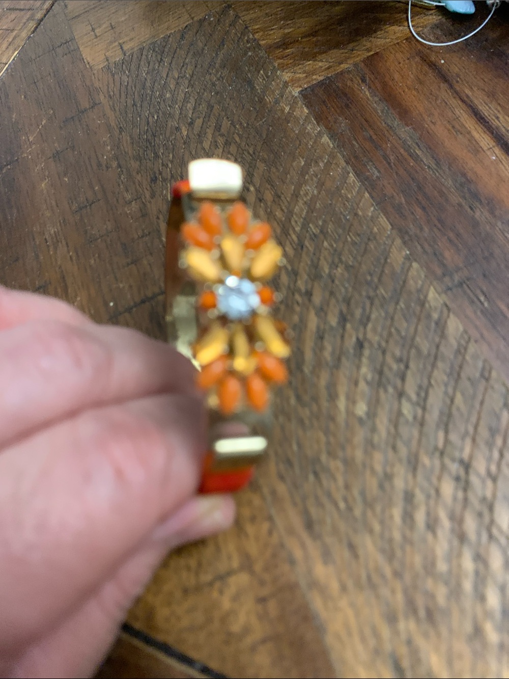 Gold-Tone Floral Accent Bracelet with Orange Details